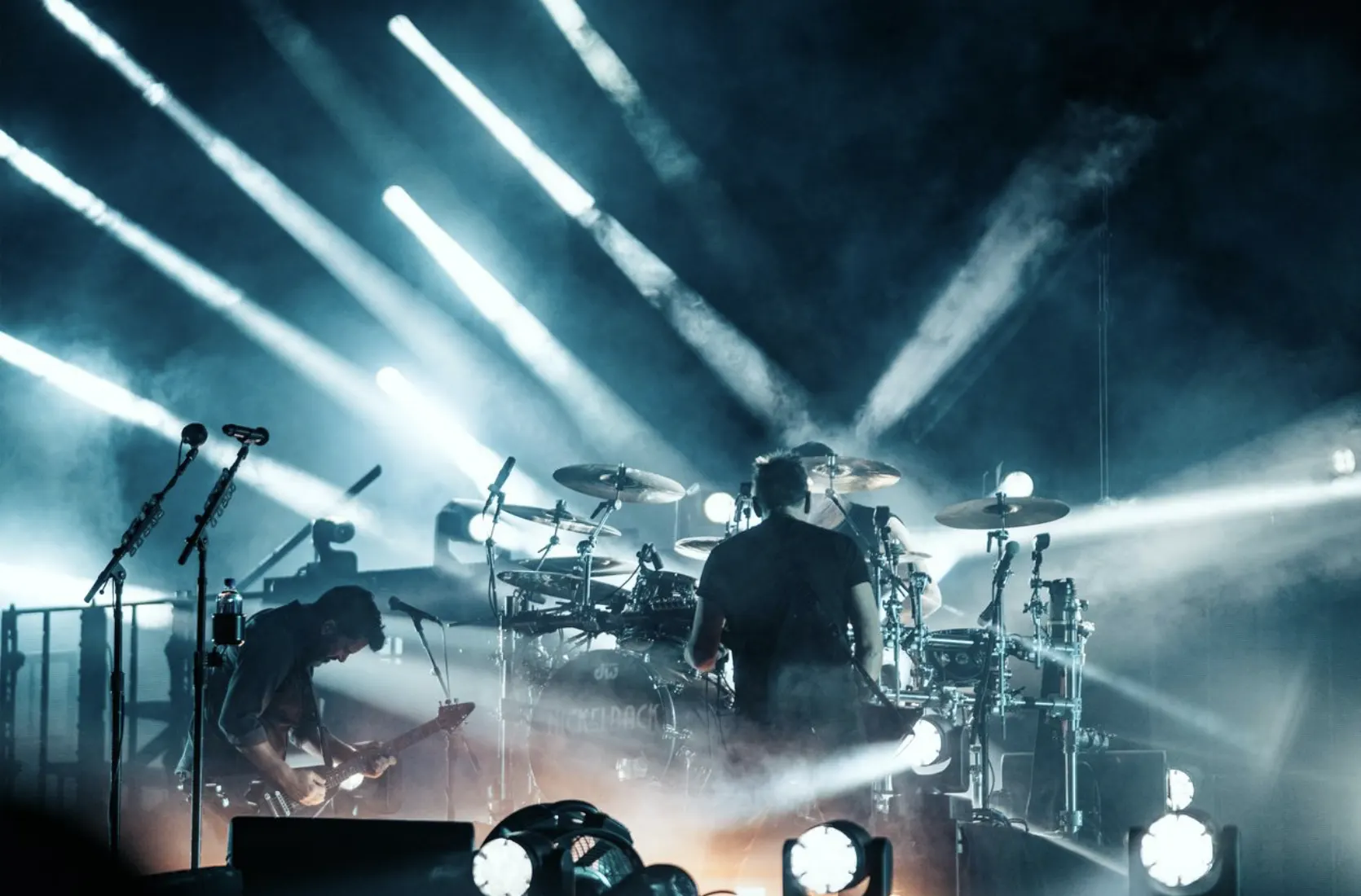 Band performing under bright stage lights