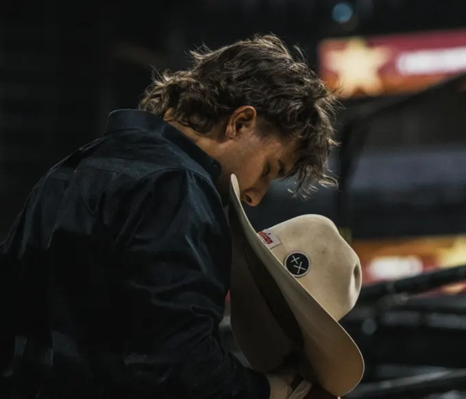 Cowboy holding his hat