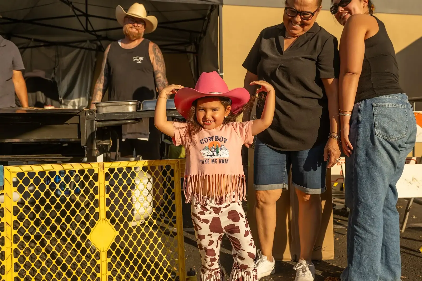 Young cowgirl in a pink hat at the Hondo Street Fest
