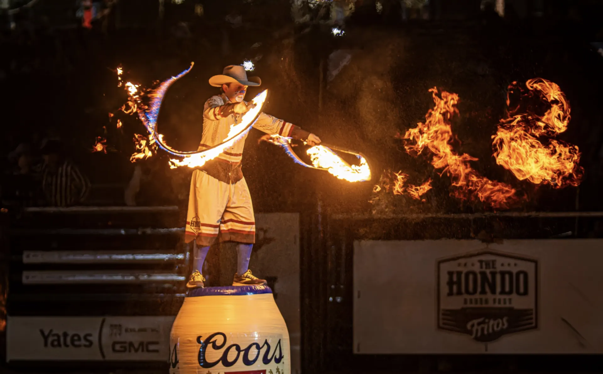 Hondo cowboy statue with fire effects above the arena